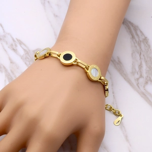 Titanium gold chain bracelet with Roman numeral round charms and black white shell inlays