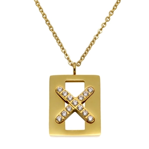 Macro detail of gold rectangle pendant with sparkling X-shape crystal inlay and link chain