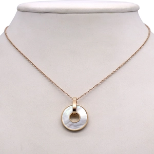 18K rose gold necklace featuring a round white mother of pearl inlay on a model bust