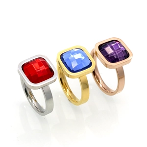 Three square-cut zircon rings in red, blue, and purple set in polished minimalist bands