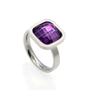 Macro view of square purple zircon gemstone set in silver-tone minimalist ring