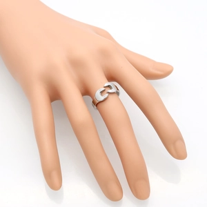 Industrial wrench-style open ring in polished silver finish on a display hand
