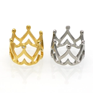 Elegant gold and silver crown rings with heart cutouts and sparkling crystal accents
