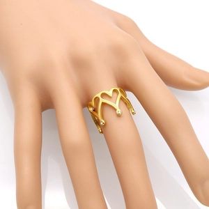 Elegant gold hollow heart crown ring with sparkling rhinestones worn on finger