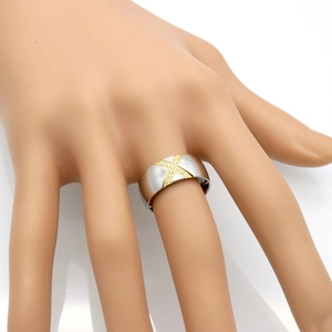 Two-tone titanium steel X-shaped ring with pavé-set zircons on white background