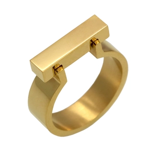 Macro shot of gold square beam ring featuring minimalist architectural design for women