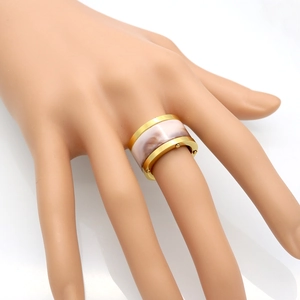 Golden titanium steel ring with pink resin inlay and beaded edges for couples