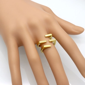 Gold double-layered minimalist ring with zircon stones shown on a model hand