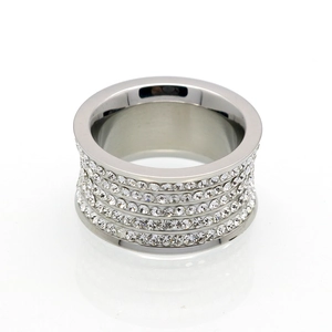 Macro detail of silver wide band ring featuring four rows of clear crystal pave setting