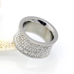 Close-up of wide silver titanium steel ring with four rows of inlaid crystal rhinestones