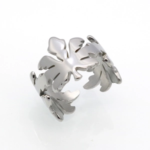 Macro shot of silver cutout maple leaf ring with adjustable open band detail