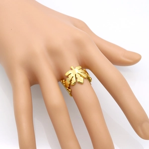 Gold hollow maple leaf open ring in stainless steel worn on a hand model