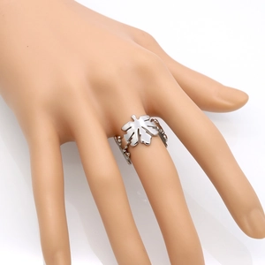 Hollow maple leaf silver ring in stainless steel shown on a hand model with white background