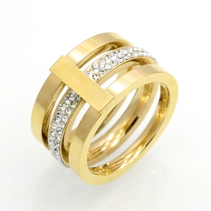 Detailed macro view of triple-layered gold band ring with pavé diamond accents