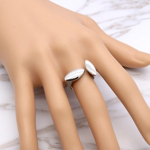 Modern silver adjustable open ring with geometric T-shape design on marble surface