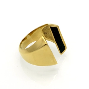 Detail shot of open gold titanium ring with a rectangular black enamel inlay design