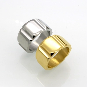 Polished stainless steel gear rings in gold and silver finish with vertical groove texture
