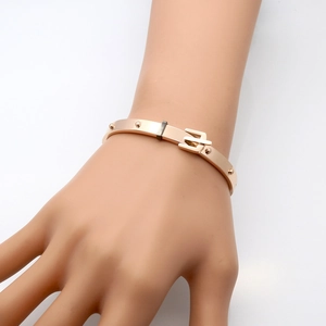 Polished rose gold stainless steel rivet belt buckle bangle for women on hand model