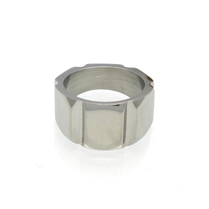 Macro view of wide silver stainless steel ring featuring geometric faceted surface