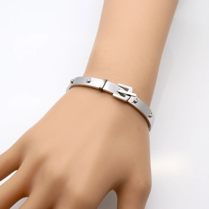 Silver stainless steel rivet cuff bracelet featuring a unique belt buckle design for women