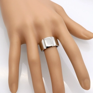 Minimalist silver gear-style stainless steel ring for men and women on model's hand