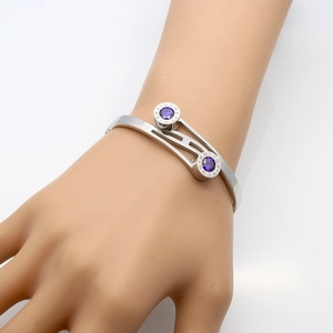 Silver Roman numeral bangle featuring dual purple zircon stones in stainless steel