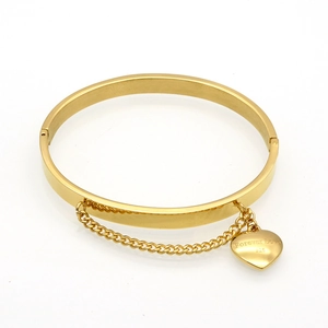 Detail of gold stainless steel bangle with fine chain and Forever Love heart pendant