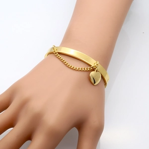 Gold stainless steel heart pendant bangle featuring a fine chain and Forever Love engraving