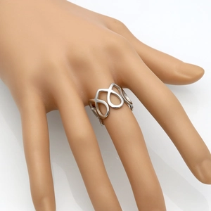 Minimalist silver geometric open ring with interlocking hollow teardrop design on hand