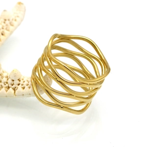 Minimalist gold wavy layered geometric titanium steel ring for women in bright studio light
