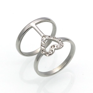Close-up of a silver titanium steel double-ring featuring a rhinestone heart design