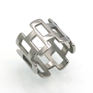 Macro shot of wide geometric hollow stainless steel ring with brushed matte finish