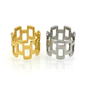 Polished gold and silver geometric hollow rectangular chain rings on white background