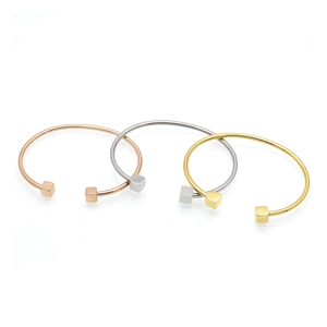 Three-piece set of minimalist 18k gold plated stainless steel open bangles in three colors