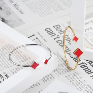 Minimalist geometric stainless steel open bangle with red rhombus star accents
