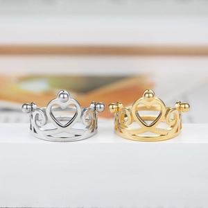 Polished gold and silver crown rings with hollow heart design and bead accents