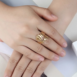 Vintage punk fishbone ring in polished gold finish with adjustable open band design