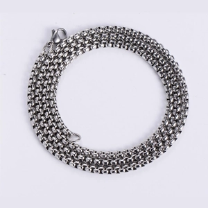 Close-up of polished silver stainless steel box chain with a secure lobster clasp closure