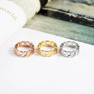Detailed close-up of Cuban link style hollow rings in rose gold, gold, and silver finishes