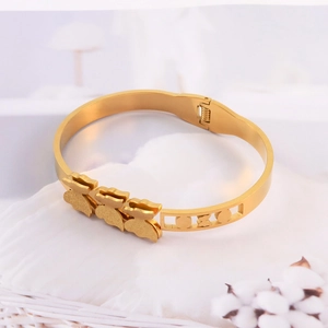 Golden matte butterfly steel cuff bracelet with sparkling texture and elegant design