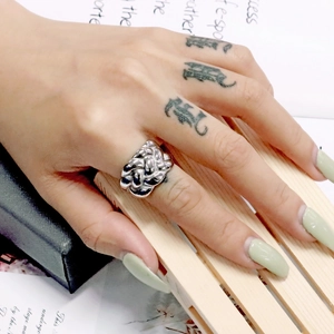 Close-up of a silver chunky twisted rope ring on a finger with stylish ins style vibe