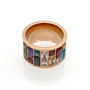 Detail of rose gold wide band ring featuring a spectrum of colorful rectangular zircons
