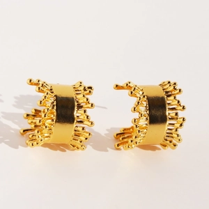 Golden wide C-shape earrings with unique irregular texture and radiant spiked edges