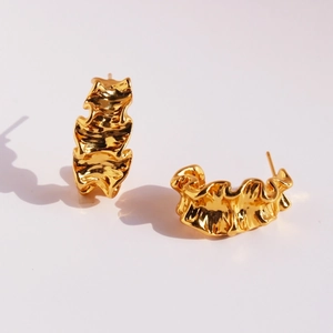 Polished gold wavy ruffle C-shaped hoop earrings with textured metal design for women