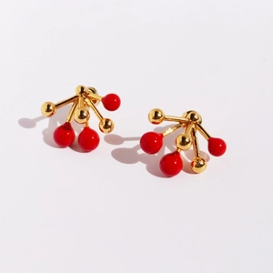 Creative festive red enamel berry cluster earrings with gold metal accents on white background
