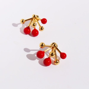 Modern 3D red enamel berry stud earrings with gold geometric spheres on white background