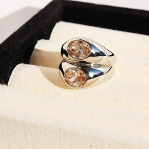 Double-layered wide silver ring with oval champagne gemstone in a jewelry box
