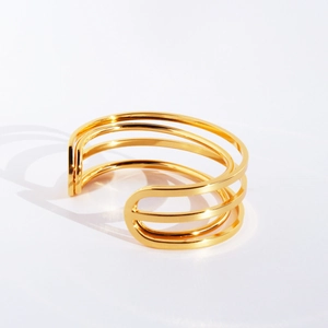 Polished gold-plated multi-layer minimalist open bangle with geometric streamlined design