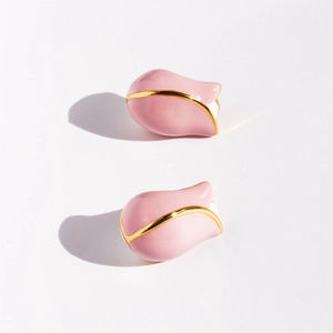 Handmade pink enamel tulip stud earrings with golden outlines on a white background