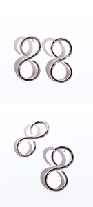 Detailed view of silver minimalist infinity figure eight geometric stud earrings